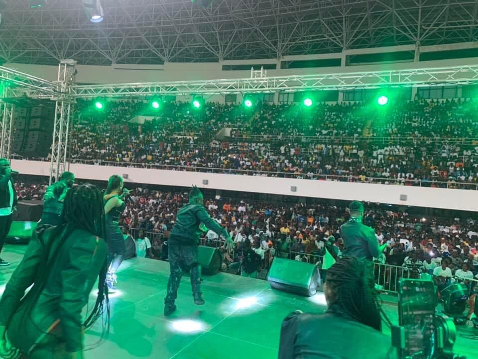 1666672820_20221023_125647.jpg Performers on a lit stage dazzled the large, seated audience in an indoor arena under green lights during Fancy Gadam's anniversary live performance.
