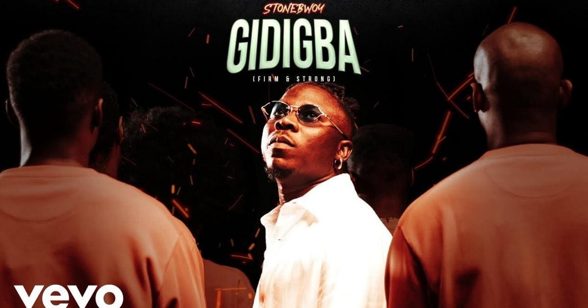 v5zktkpTURBXy8yZjI0MjVkODFmMWM4MTIwY2Q4NDdjYmFlODk0YjI1NS5qcGeSlQMAAM0FAM0C0JMFzQSwzQJ2.jpeg Cover art for Stonebwoy's single "Gidigba (Firm & Strong)," showing Stonebwoy in sunglasses, facing the camera, with two people in matching outfits facing away. "VEVO" logo is seen in the bottom left, hinting at action-packed visuals.