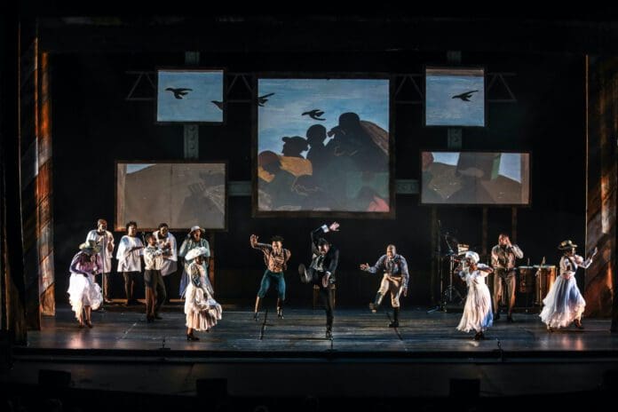 29021_col.jpg A live performance on stage featuring actors in historical costumes will captivate Tri-Valley audiences. Multiple screens display projected images of birds and a significant historical scene, making it an event to remember during Black History Month 2023.