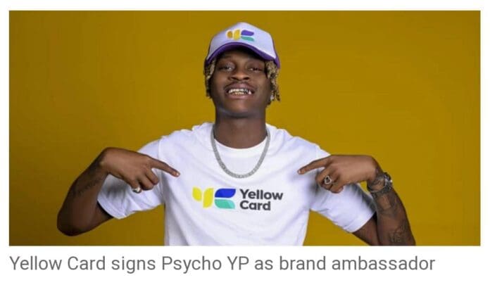 Yellow-Card.jpg Person in Yellow Card branded clothing and cap, pointing to the Yellow Card logo on their t-shirt, with a yellow background. Caption below reads, "Yellow Card signs Psycho YP as brand ambassador.