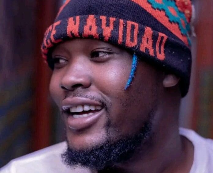 A man wearing a colorful beanie and smiling captures women's hearts with 'Anzao A Bae'. A man wearing a colorful beanie and smiling captures women's hearts with 'Anzao A Bae'.