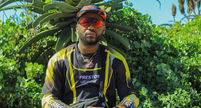 Okmalumkoolkat sitting with sunglasses on. Okmalumkoolkat sitting with sunglasses on.