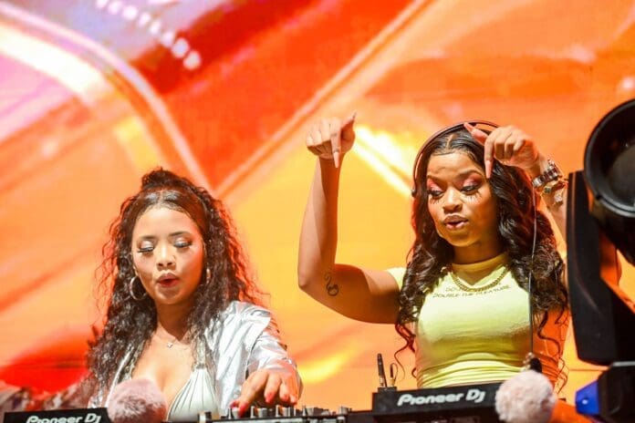 Two women standing in front of a DJ booth at the Walker Town Nairobi edition. Two women standing in front of a DJ booth at the Walker Town Nairobi edition.