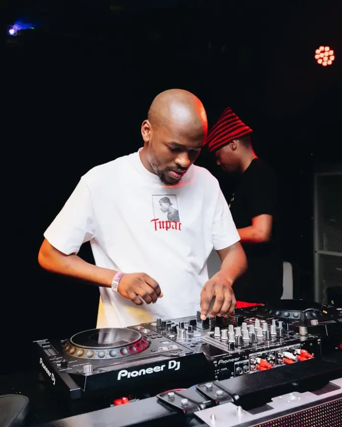 A man playing a dj set. A man playing a dj set.