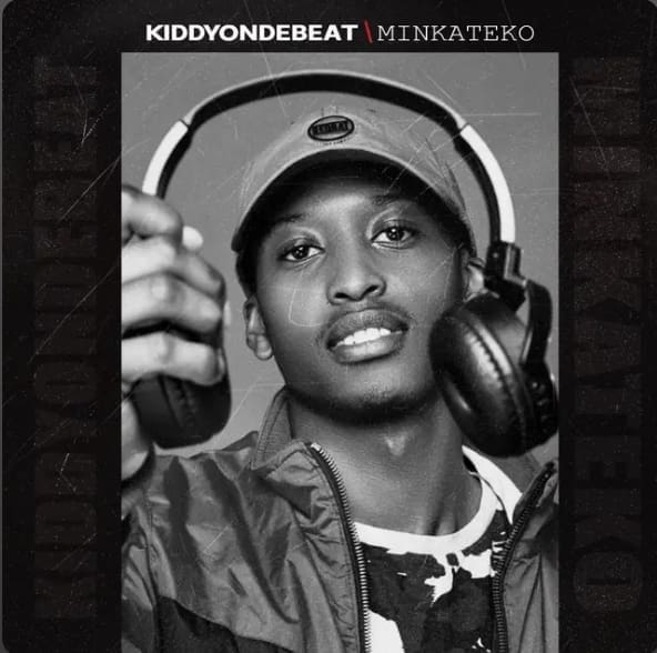 Kiddyondebeat, a man wearing headphones, is holding a microphone. Kiddyondebeat, a man wearing headphones, is holding a microphone.