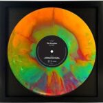 Afropop-African Music Vinyl record with a vibrant geometric-patterned cover. An exploration of diverse genres and pays homage to the rhythmic brilliance of African musicians.