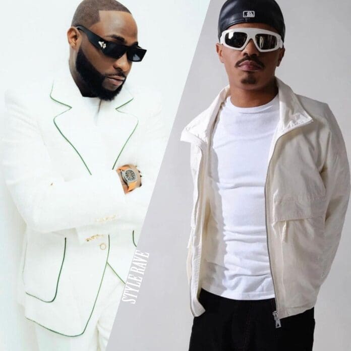 IMG_4475.JPEG.jpg Two men in stylish white outfits channeling Afrobeats vibes with their sunglasses. One rocks a white suit, while the other sports a jacket and cap, exuding the flair of artists like Davido.