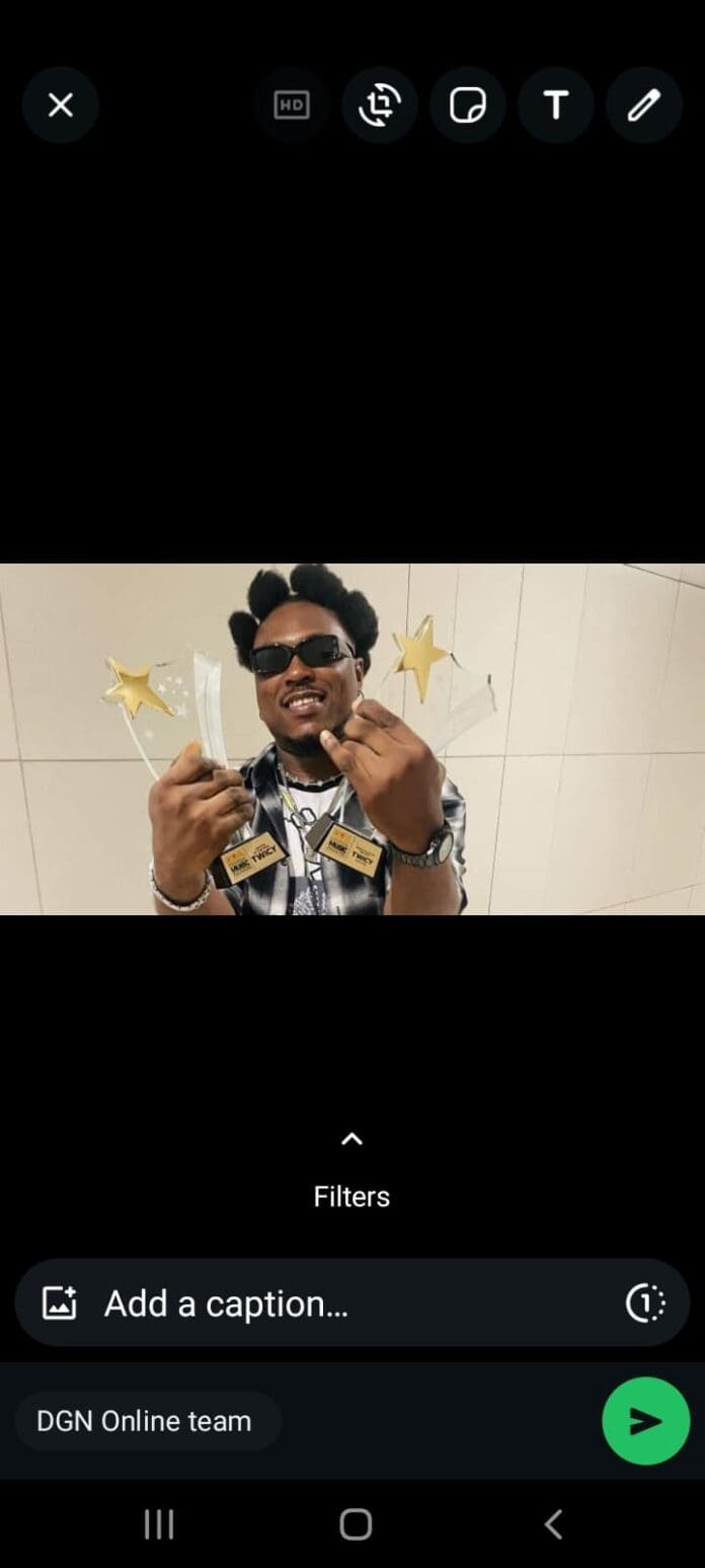 Screenshot_20241223-194741_WhatsApp.jpg A person in sunglasses and a checkered shirt holds multiple star-shaped awards, including those from the Central Music Awards, with a neutral expression against a tiled background.
