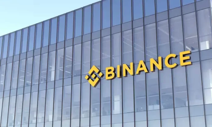 Binance-Building-1024x614-1.webp.webp A glass office building in Nigeria features the yellow Binance logo and name prominently displayed on its facade, capturing the attention of Techpoint Africa readers.