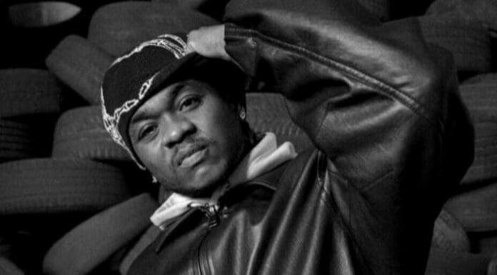 Screenshot_20250505-213951.jpg A person wearing a beanie and leather jacket poses with one hand on their hat, standing in front of a stack of tires—channeling Dice Ailes vibes and the cool energy of an Afrobeat new single.