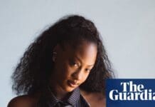 Tems is uplifting women to smash sexism in music. Can the industry change its tune? – The Guardian A woman with long, curly hair and a striped sleeveless top poses against a plain light background, representing the strength of women in music; The Guardian logo is in the lower right corner.